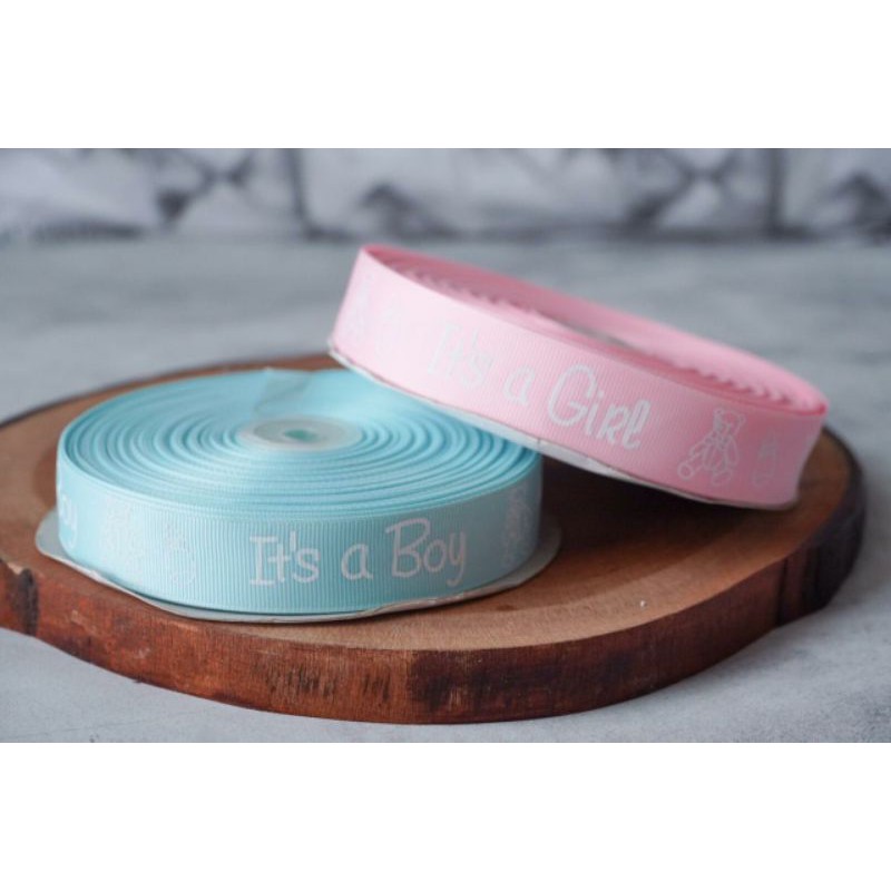 

PITA GROSSGRAIN PRINTED PREMIUM TULISAN IT'S A GIRL ( IT'S A BOY 1) ECER PER METER