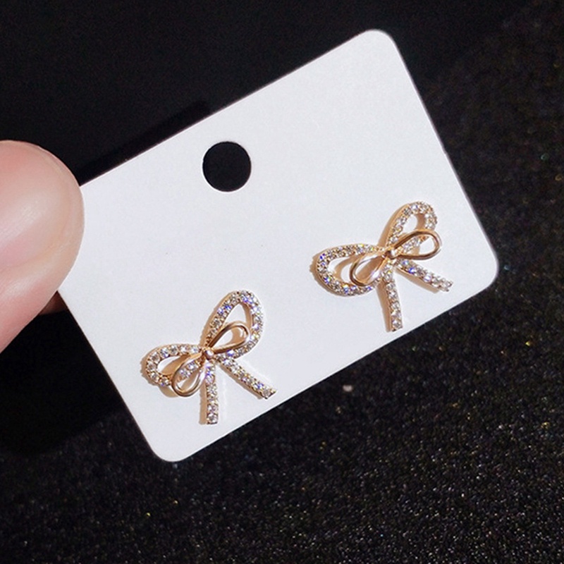 Fancyqube Anting Stud Kristal Cubic Zirconia Bentuk Pita Warna Emas Untuk Wanita