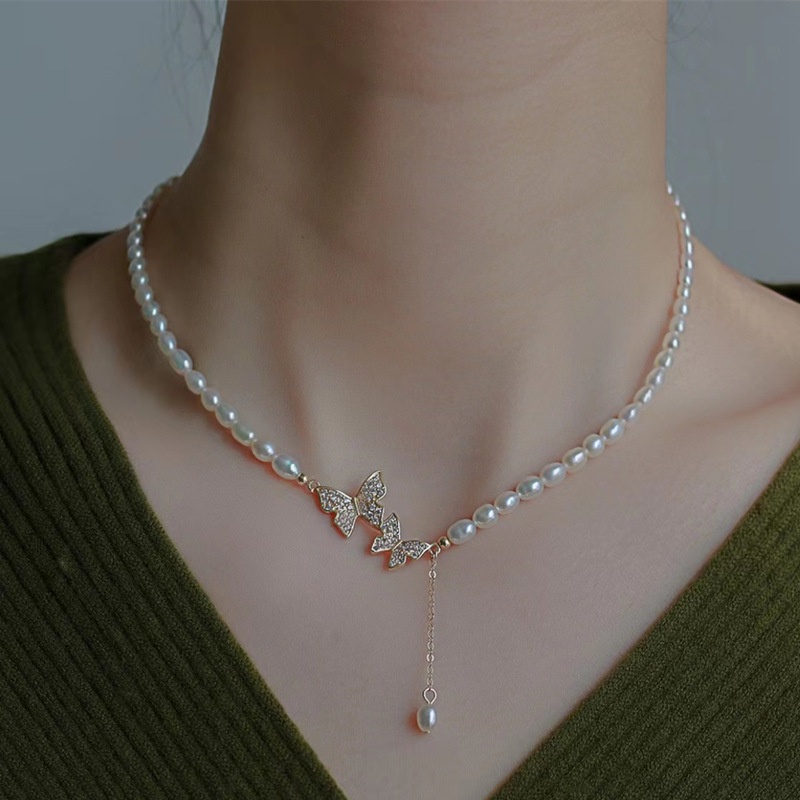 Kalung Rantai Clavicle Desain Kupu-Kupu Asimetris Hias Zircon + Mutiara Imitasi Untuk Wanita