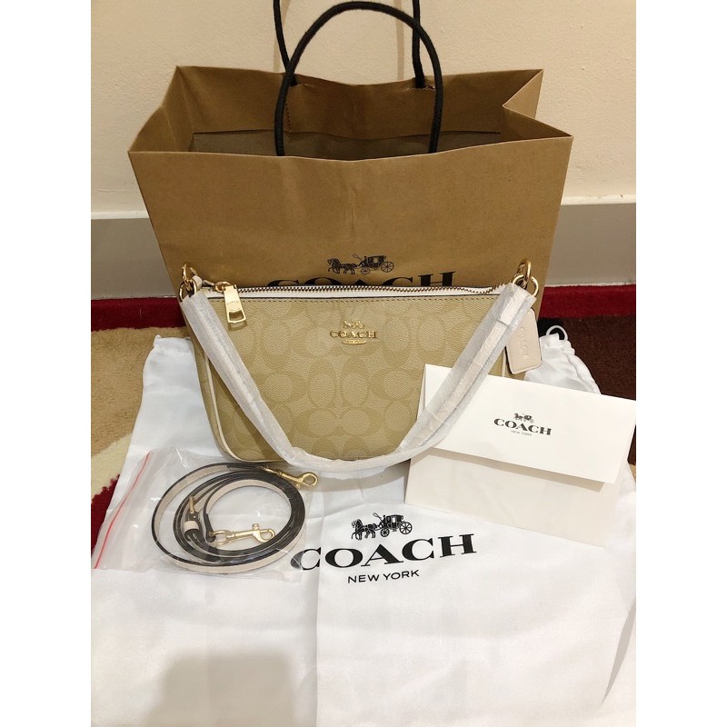 COACH POUCH TOP HANDLE SIGNATURE MAHOGANY