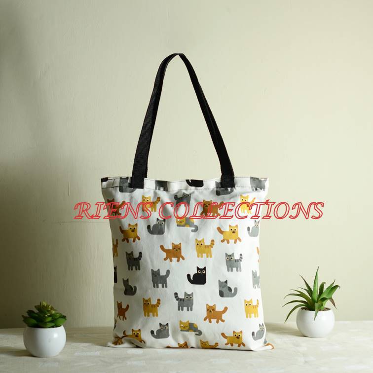 TOTEBAG KANVAS . TAS KANVAS MOTIF KUCING LATAR PUTIH. RIENS COLLECTIONS