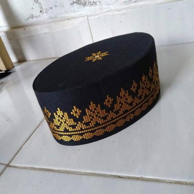 Peci songket tenun batubara