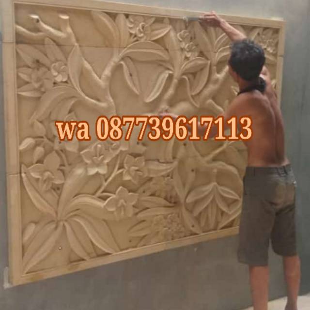relief bunga  batu ukir hiasan dinding