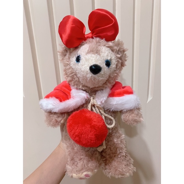 boneka duffy jubah pita merah