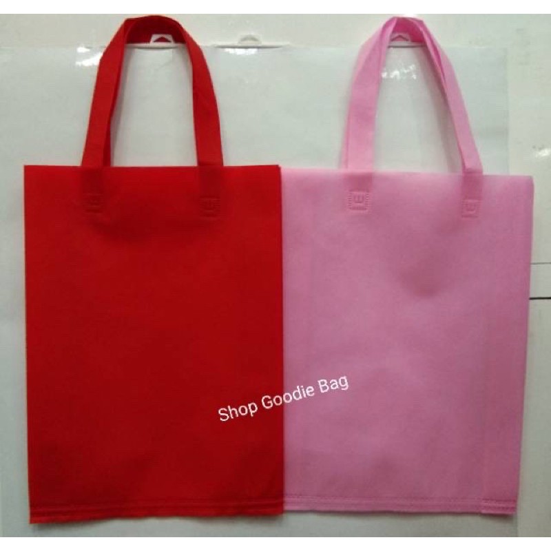 

Tas Spunbond Handle uk 30x40x8 / Goodie Bag / Tas Kain Polos