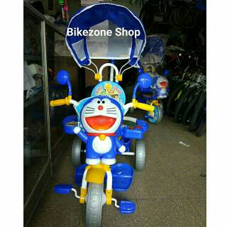 SEPEDA RODA TIGA ANAK NAKAMI DORAEMON PENGAMAN MUSIK SEPEDA RODA TIGA ANAK NAKAMI DORAEMON PENGAMAN MUSIK