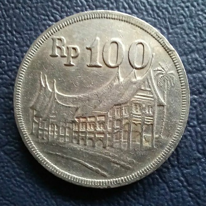 Uang koin kuno 100 rupiah rumah gadang tebal emisi tahun 1973