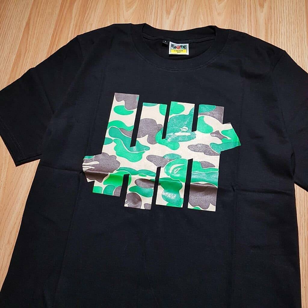 1071 KAOS TSHIRT BAPE X LOGO UNDEFEATED CAMO GREEN BLACK KAOS BAPE BAJU BAPE KAOS HITAM