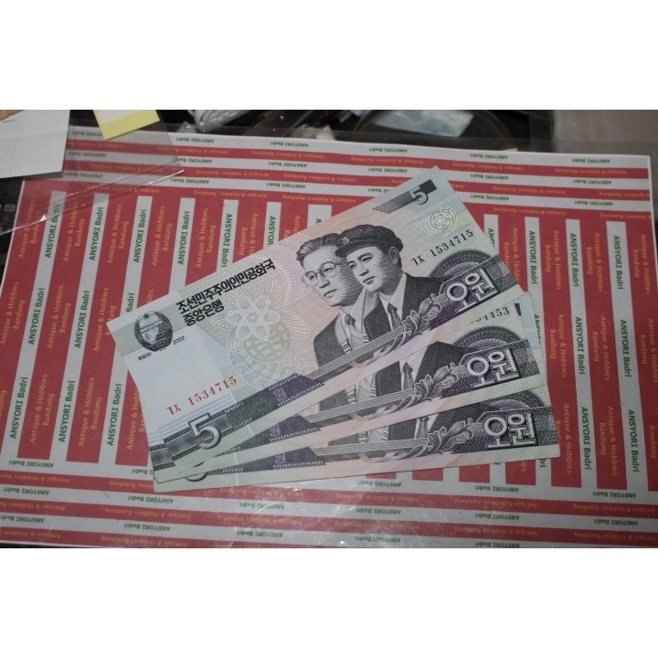 Uang Korea Utara 5 Won Iklan F609