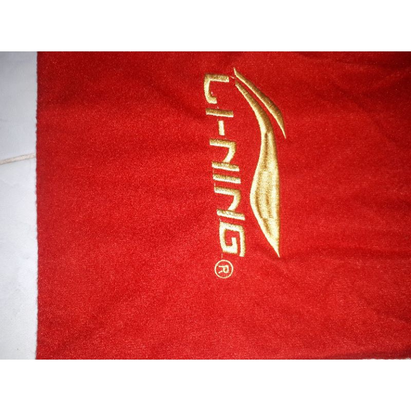 tas raket kain/serut logo bordir