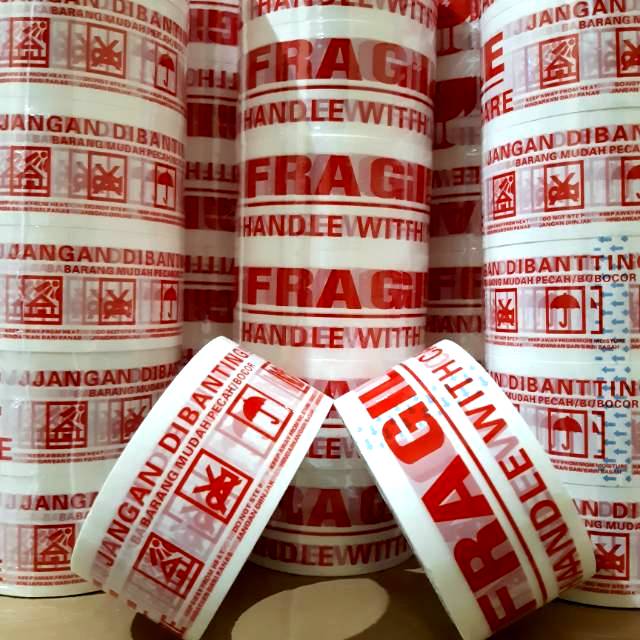 

LAKBAN FRAGILE PUTIH MURAH DAN TEBAL 2" (48MM × 60 YARD) HARGA PABRIK PROMO!!!