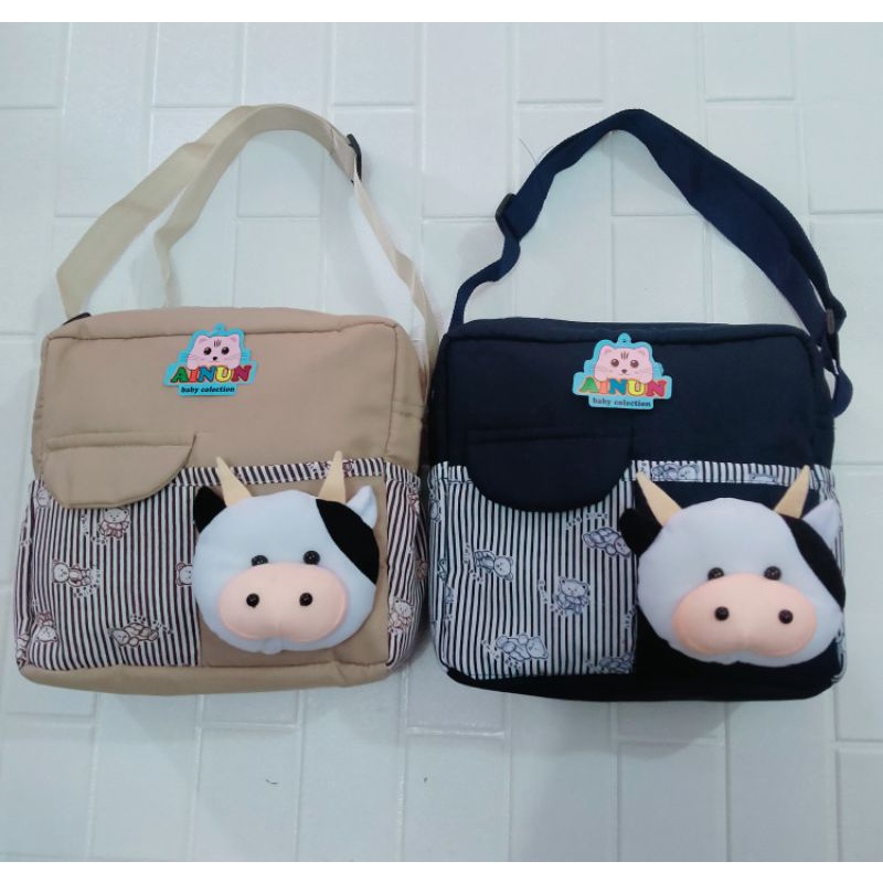 PROMO !!! Tas bayi dengan  saku depan tutup dengan tambahan boneka sapi lucu