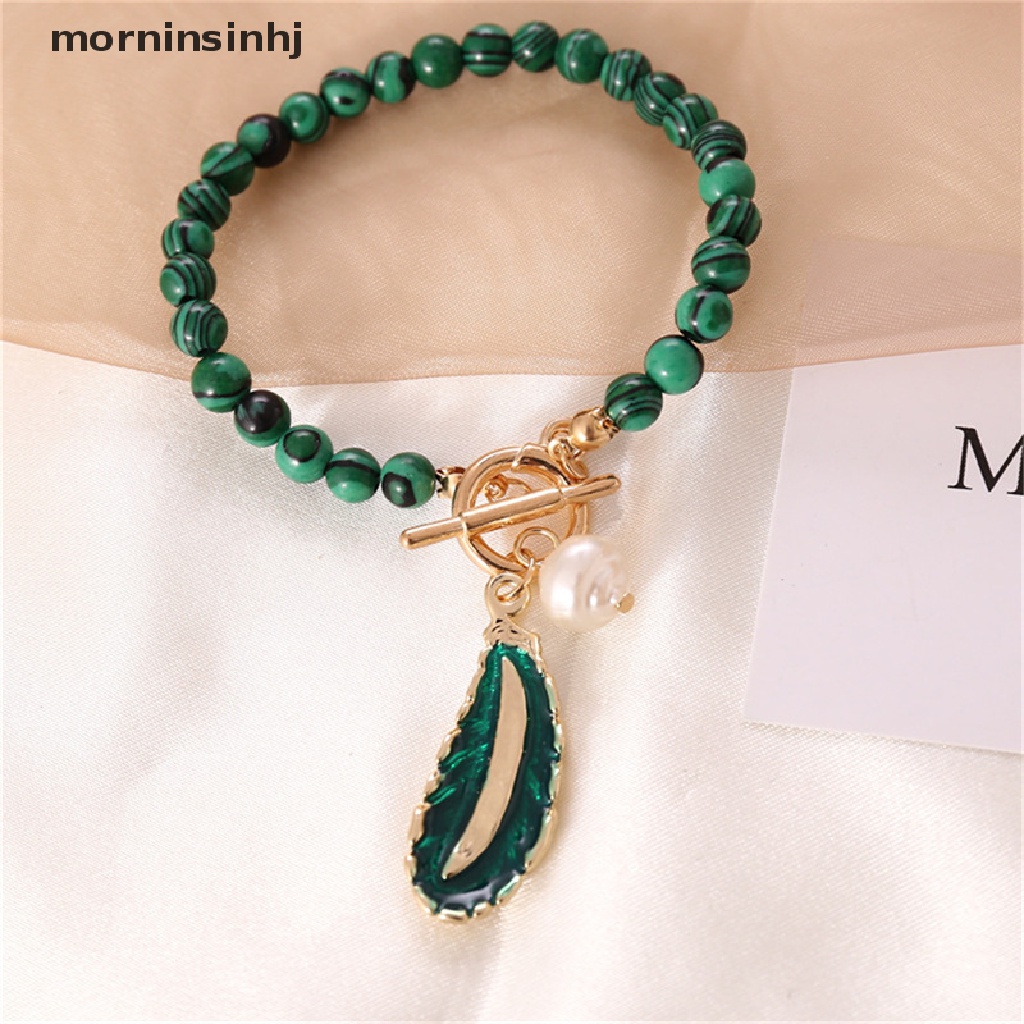 Mor Liontin Daun Malachite Alami