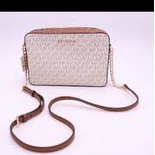 tas M_K jet set crossbody signature vanilla