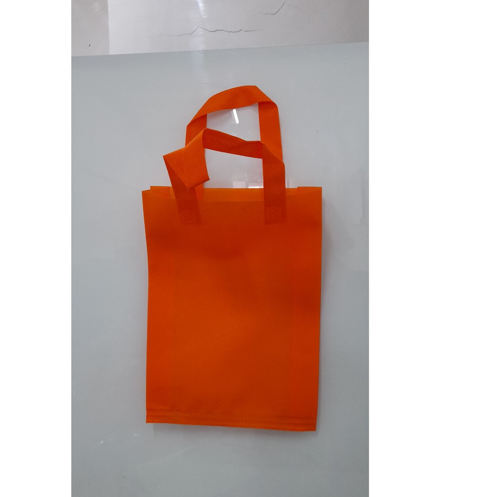 

Tas Press Spunbound Tali Goodie Bag Tas Belanja Warna Orens 25 cm x 35 cm