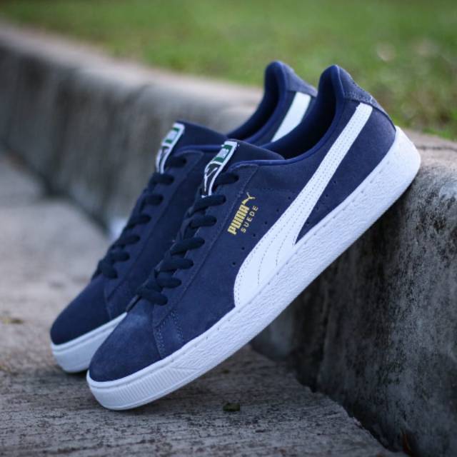 navy and white pumas