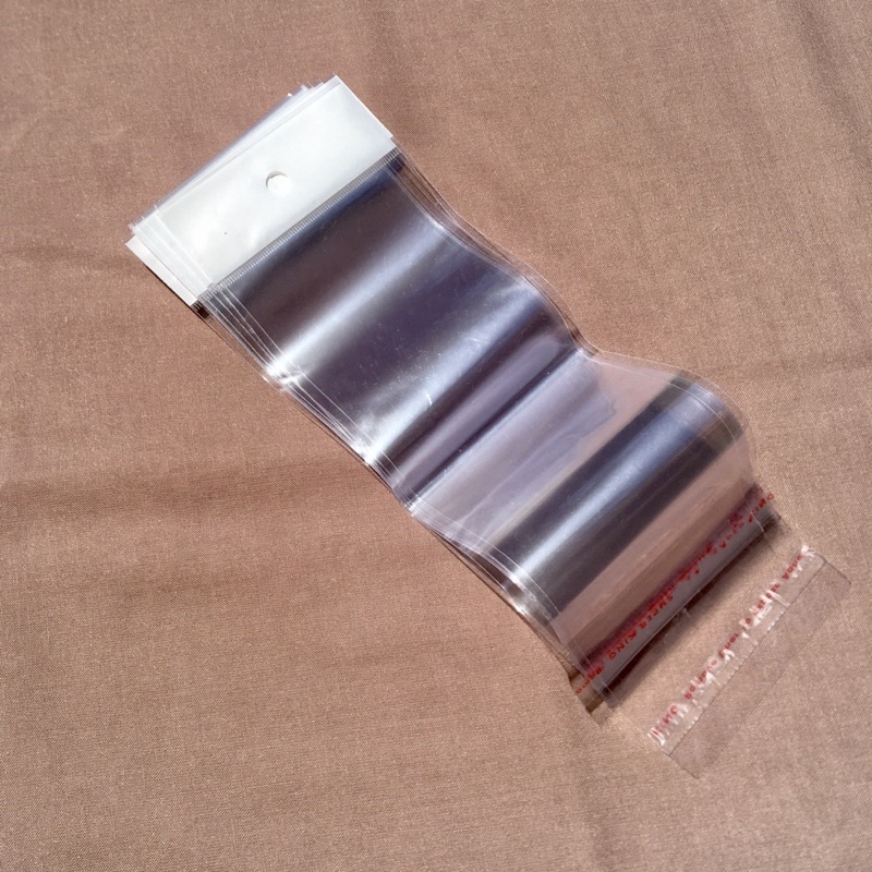 

Plastik OPP Lubang Gantung + Perekat