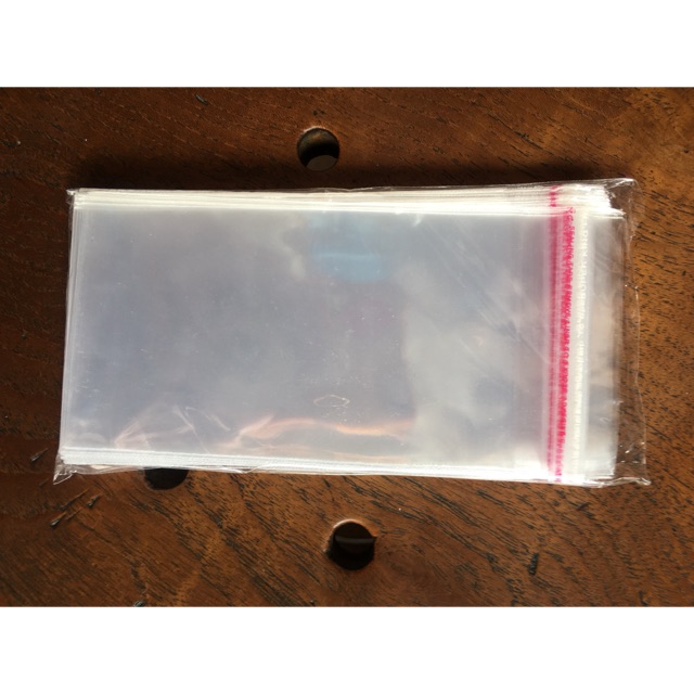 

Plastik OPP pakai lem 9x10 9x12 9x14 9x16 9x20 9x25 cm perekat plastik kue makanan souvenir