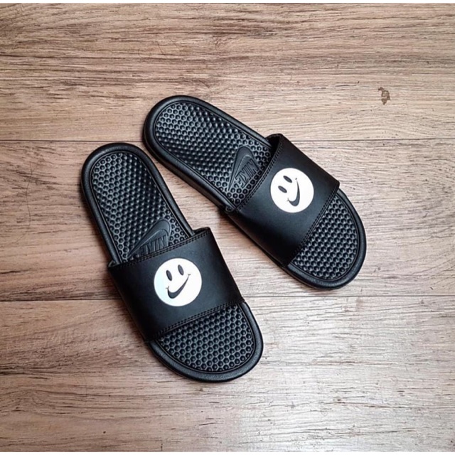 nike slides with smiley face