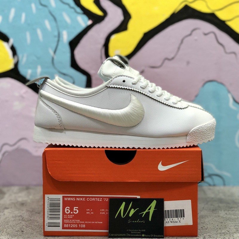 all white cortez womens