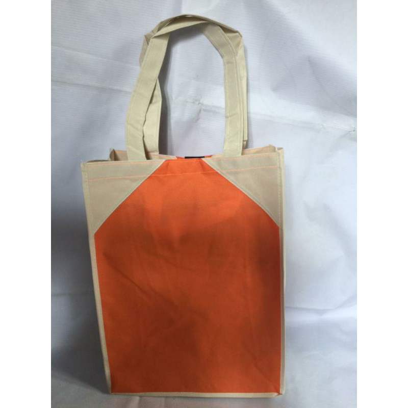 

Tas Polos Bahan Tebal D600 / Spounbond Tebal Goodie Bag