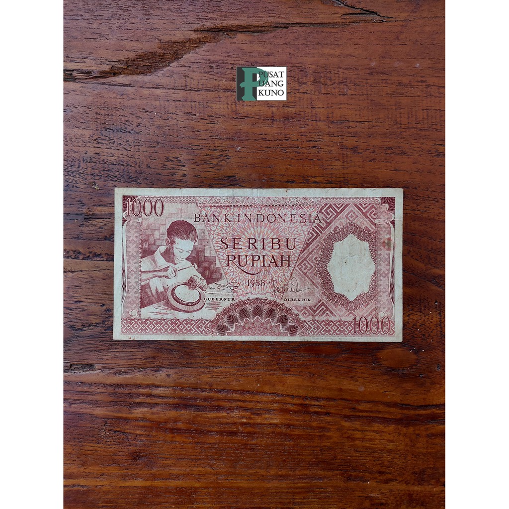 

Uang kertas 1000 rupiah tahun 1958 pengukir perak Coklat