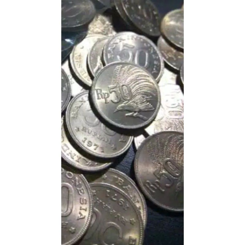 koin cendrawasi 50 rupiah tahun campur.koin kuno.koin logam  bisa di gunakan sarana upacara