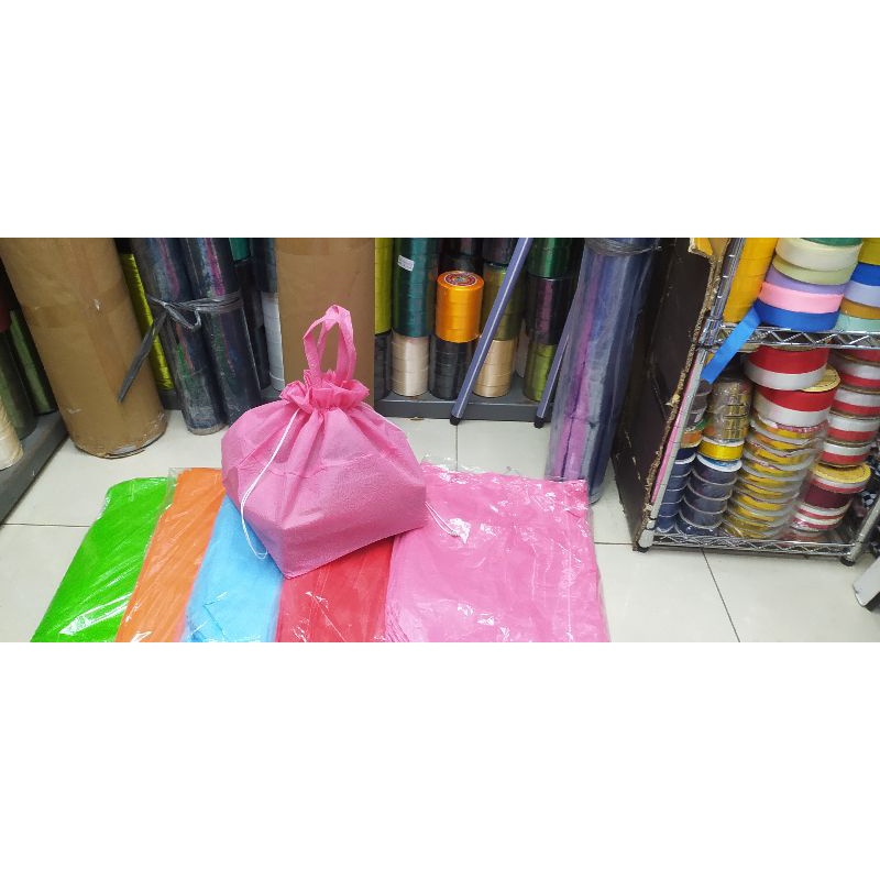

tas kain spunbond embos buat nasi box 22 isi 12 pcs