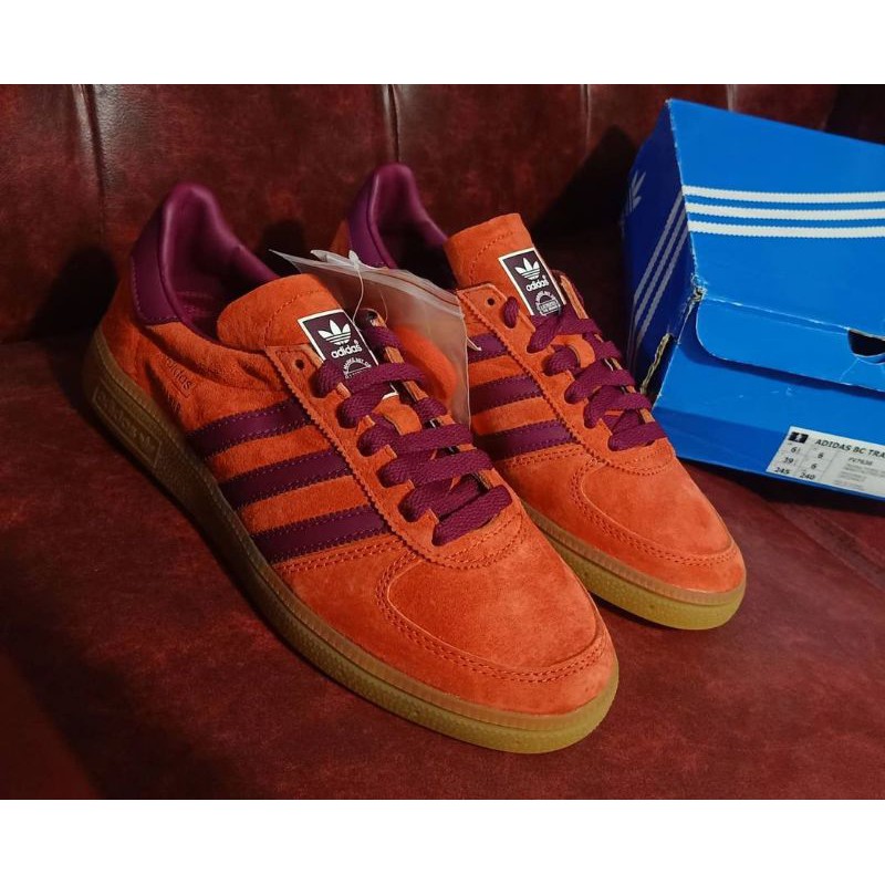 red and orange trainers
