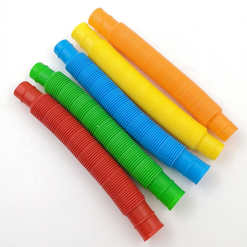 Mainan Edukasi Dini Anak Tabung Coil Pop Plastik 5 Warna