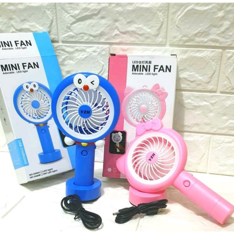 Kipas Mini Tangan Genggam Tancap Karakter Doraemon Hello Kitty Fan Led Light Lucu Unik Portable USB