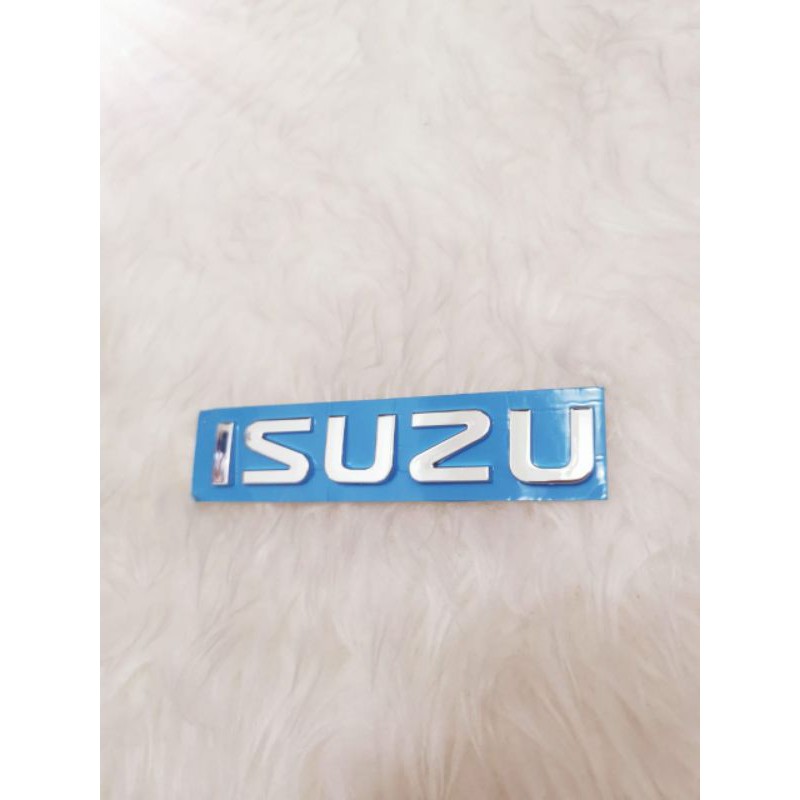 Emblem tulisan isuzu