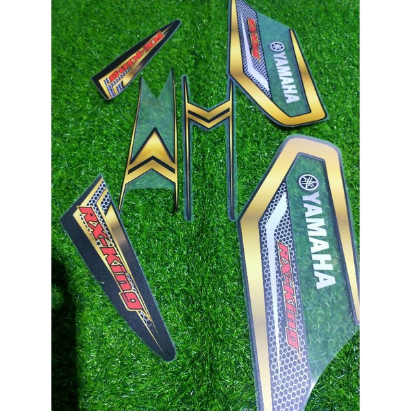 Striping transparan UV RX KING motif carbon gold