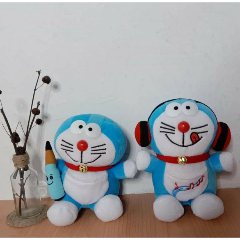 

Boneka doraemon SNI pensil/wokmen S