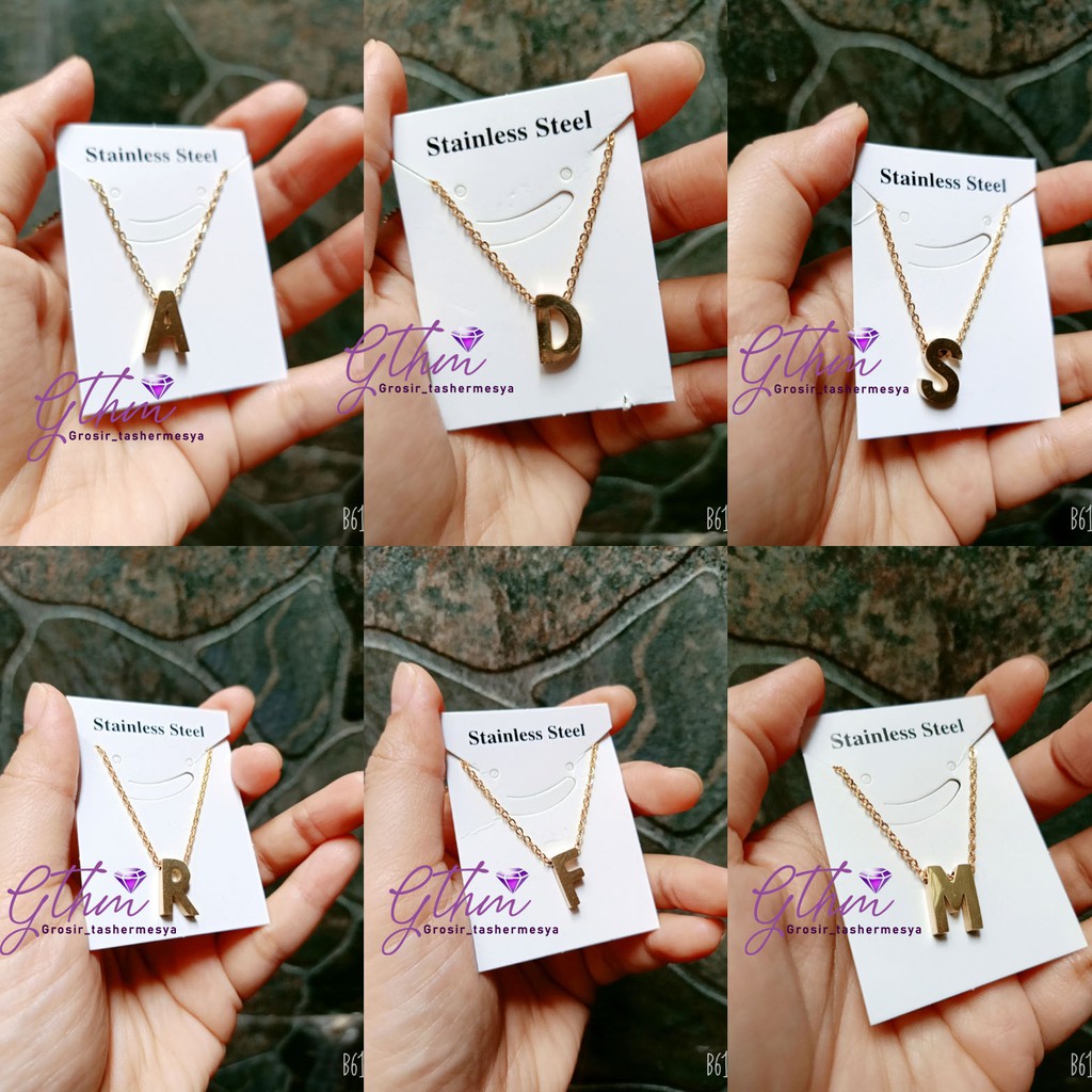 kalung TITANIUM abjad nagita Kecil simpel mewah seperti emas asli anti karat kt019