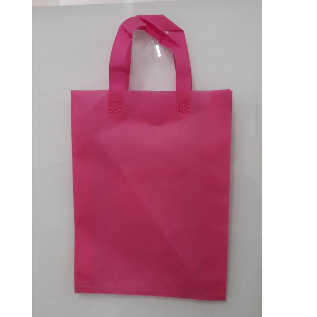 

Tas Press Spunbound Tali Goodie Bag Tas Belanja Warna Pink 25 cm x 35 cm