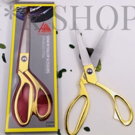 

Pus Gunting Kain dengan gagang emas uk.9.5 inch
