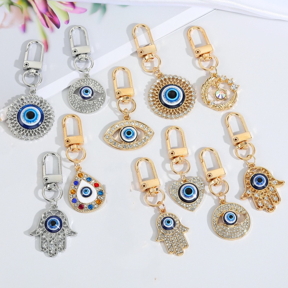 Gantungan Kunci Desain Mata Iblis Bulat Hollow Warna Biru Untuk Pria / Wanita
