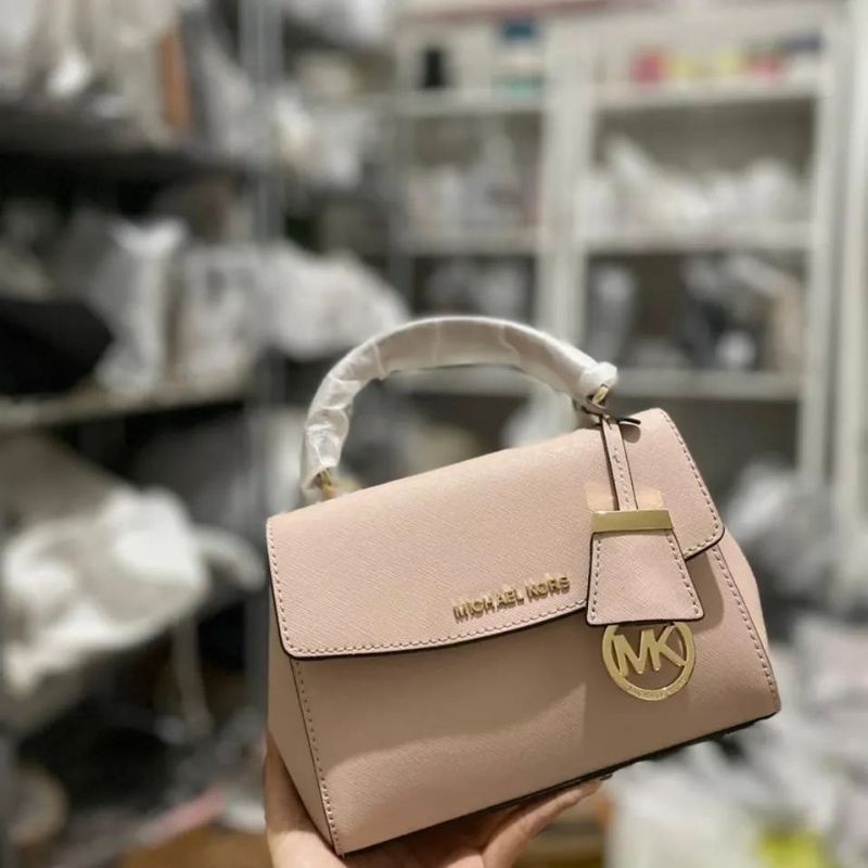 upload tas mk ava xs crossbody blush