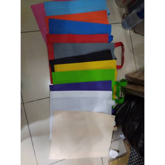 

(38*45)Tas kain spunbond lipat samping isi 12pcs/terlaris dan termurah(38*45)