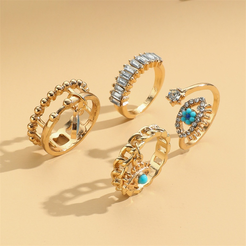 4pcs / Set Cincin Knuckle Desain Mata Iblis Aksen Kristal Warna Emas Gaya Vintage Boho Untuk Wanita