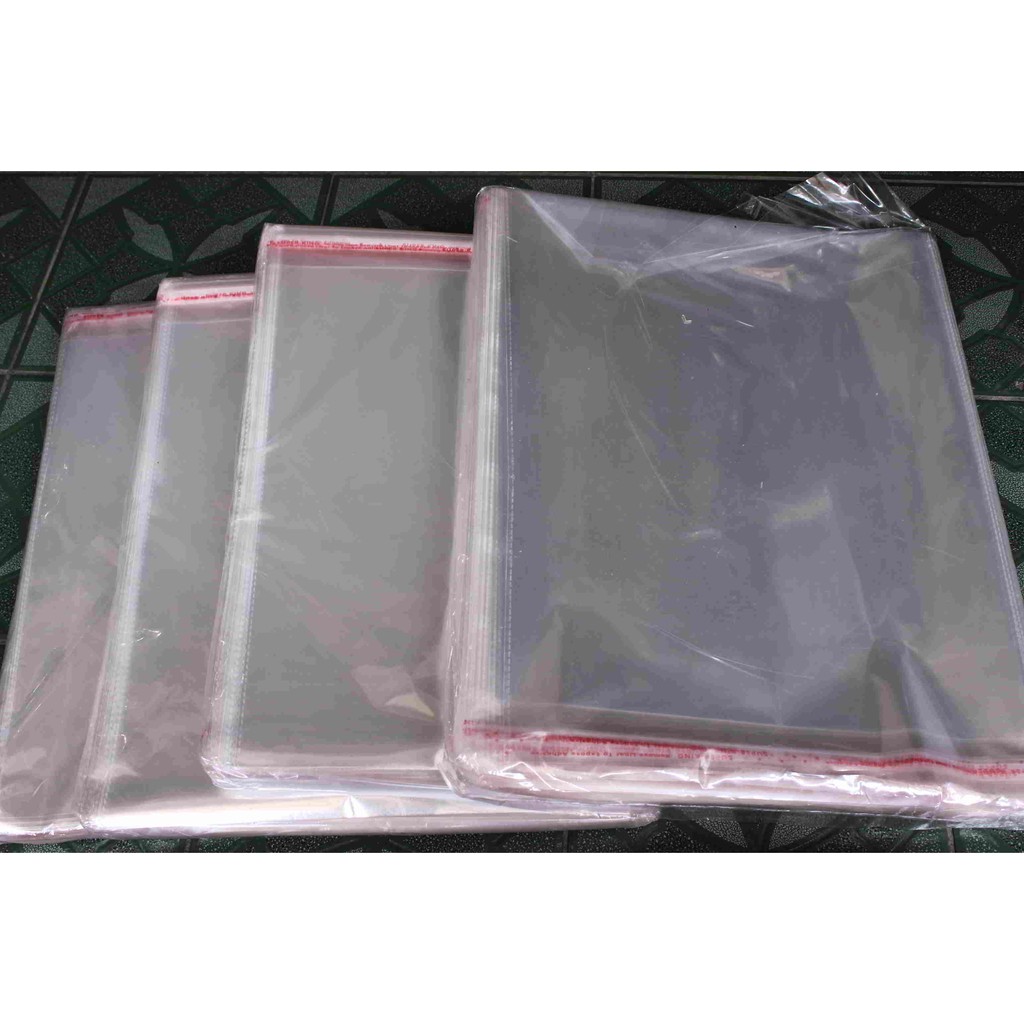 Plastik Packing Baju  Bening Opp Uk 30x37 Lem Seal