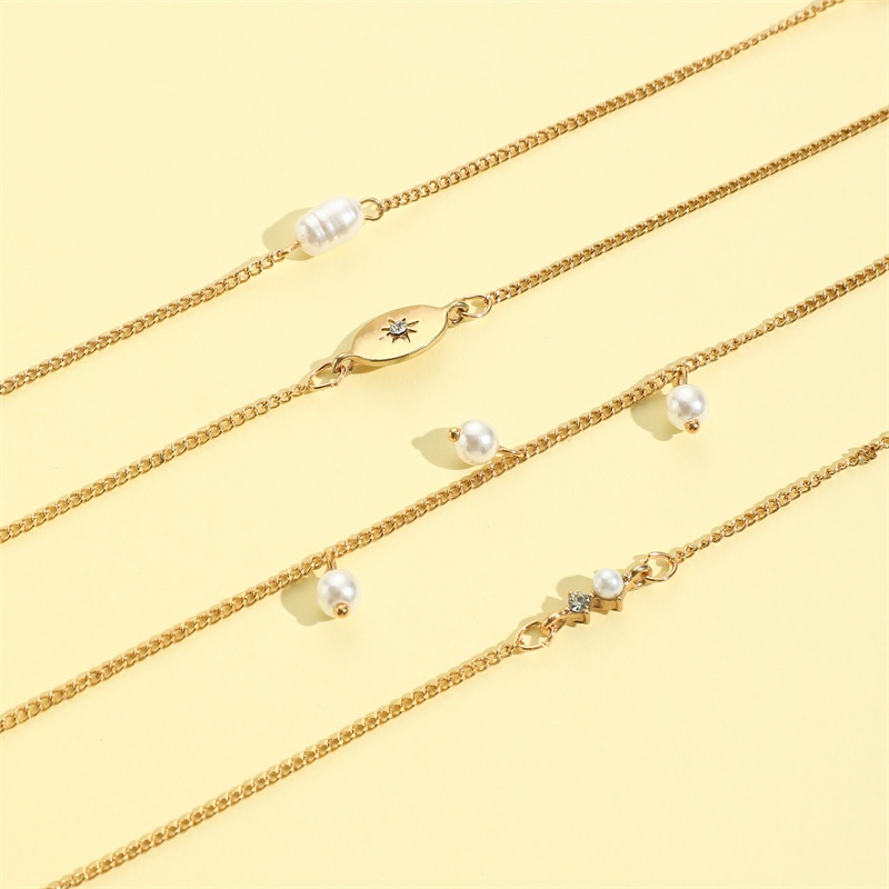 4pcs / Set Gelang Tangan Alloy Lapis Emas Desain Bintang Hias Mutiara Imitasi Untuk Wanita