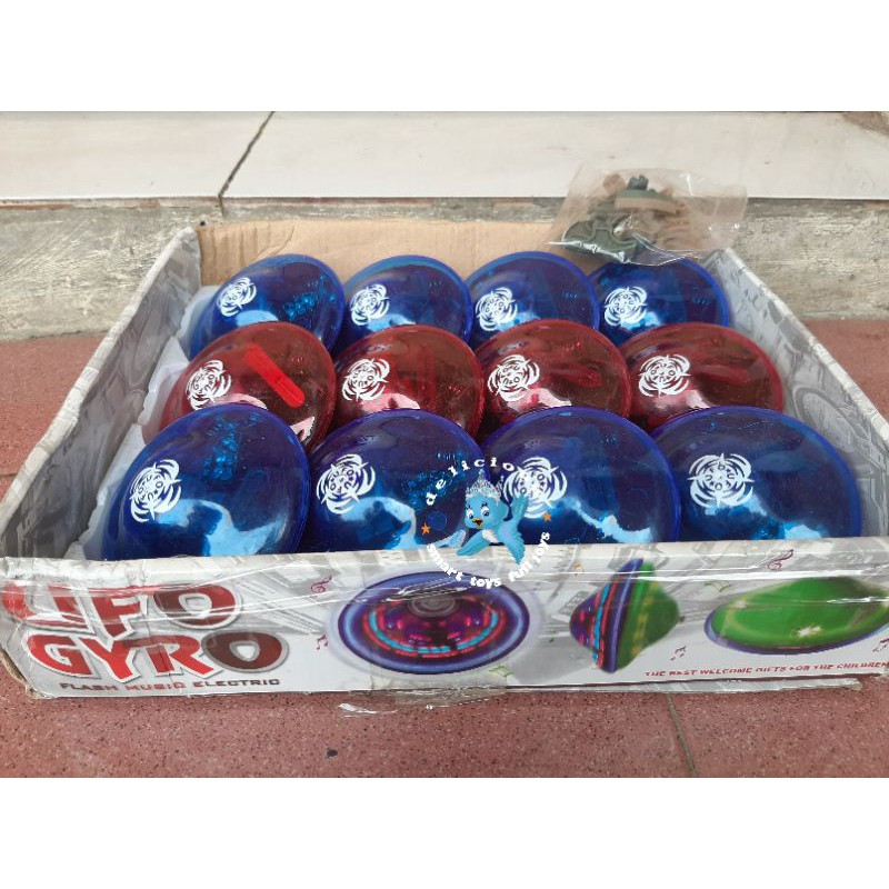 Mainan gangsing UFO musik dan lampu