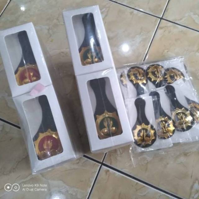 Tanda jabatan pembina pramuka tumpuk