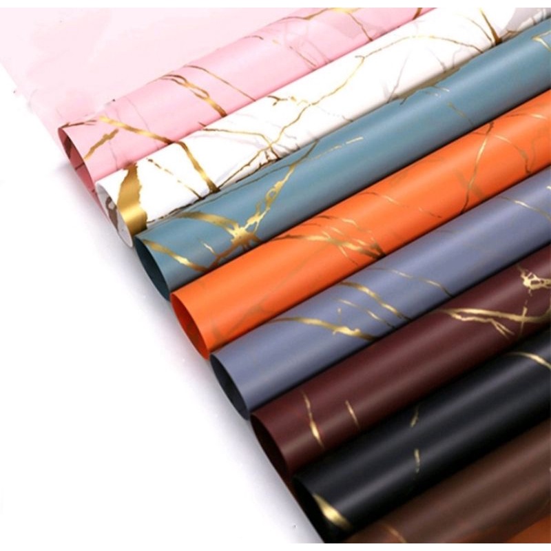 

Kertas Cellophane Marble Gold 58cm x 58cm ecer