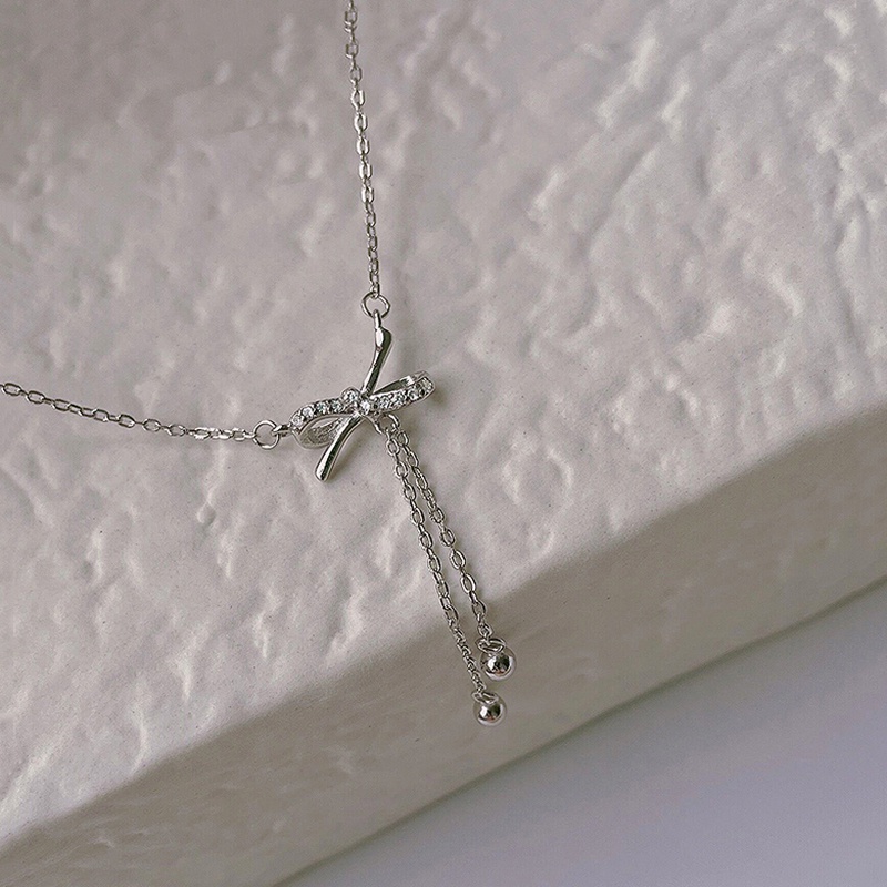 Kalung Rantai Rumbai Liontin Pita Aksen Kristal Warna Silver Untuk Wanita