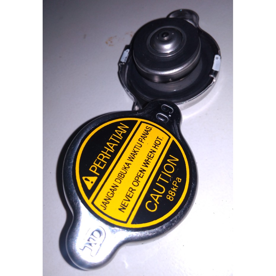 Spare Part Mobil - Busi - Otomotif Tutup Radiator Kijang Kapsul Super Grand Soluna Original Ready