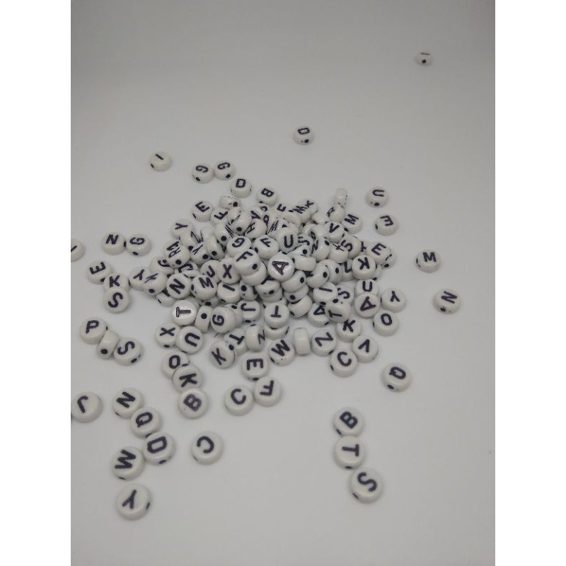 

mote huruf putih hitam per 30gr