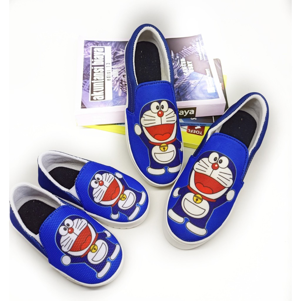 DINDA SEPATU WANITA SLIP ON DORAEMON REALPICT 100% MURAH - BIRU DAN HITAM
